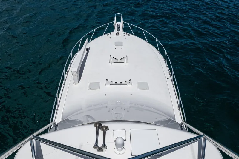 Slide: The Image of Bow view of 2005 Viking 61 yacht on open water. - 7