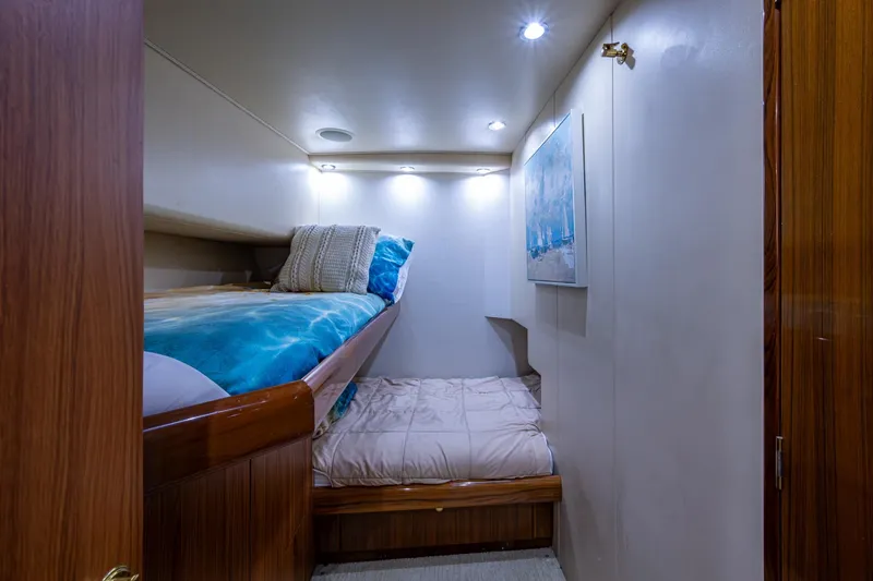Slide: The Image of Cozy cabin interior with bunk beds in 2005 Viking 61 yacht. - 74