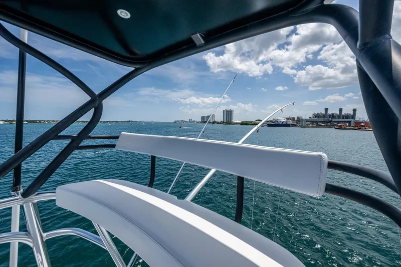 Slide: The Image of View from a 2005 Viking 61 yacht, overlooking a sunny waterfront cityscape. - 8