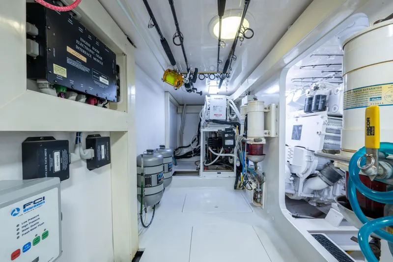 Slide: The Image of Engine room of 2005 Viking 61 yacht, featuring advanced equipment and systems. - 91