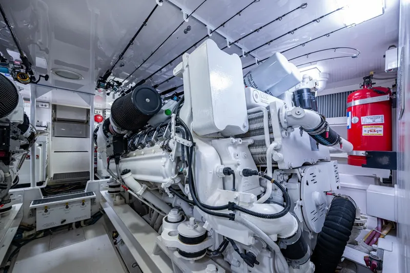 Slide: The Image of Engine room of a 2005 Viking 61 yacht, showcasing powerful machinery and equipment. - 93