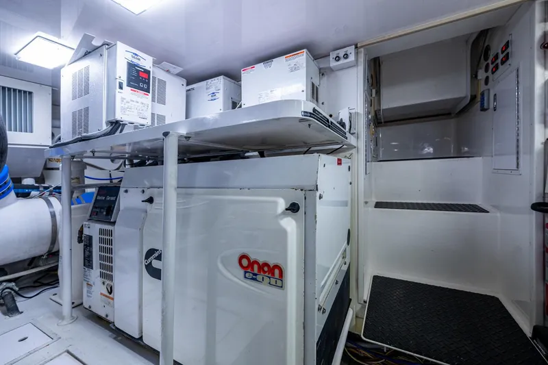 Slide: The Image of Engine room of 2005 Viking 61 yacht with Cummins Onan generator. - 95