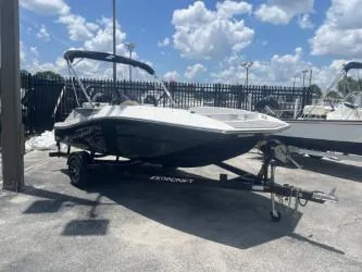 Slide: The Image of 2025 Starcraft SV 16 boat on trailer under a sunny sky. - 2