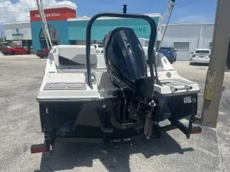 Slide: The Image of 2025 Starcraft SV 16 boat with outboard motor, parked outdoors on a sunny day. - 5