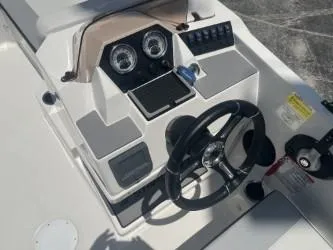 Slide: The Image of 2025 Starcraft SV 16 boat dashboard with steering wheel and instrument panel. - 8