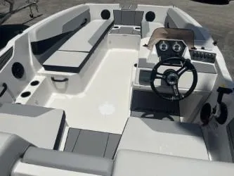 Slide: The Image of 2025 Starcraft SV 16 boat interior with seating, steering wheel, and control panel. - 9