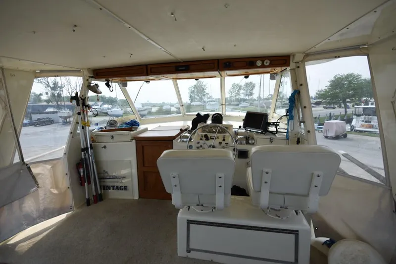 Slide: The Image of Interior of a 1967 Hatteras 41 Twin Cabin boat with helm and seating. - 10
