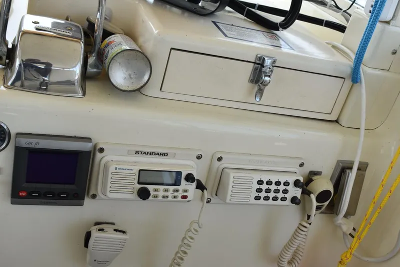 Slide: The Image of Control panel of a 1967 Hatteras 41 Twin Cabin with communication devices and controls. - 18