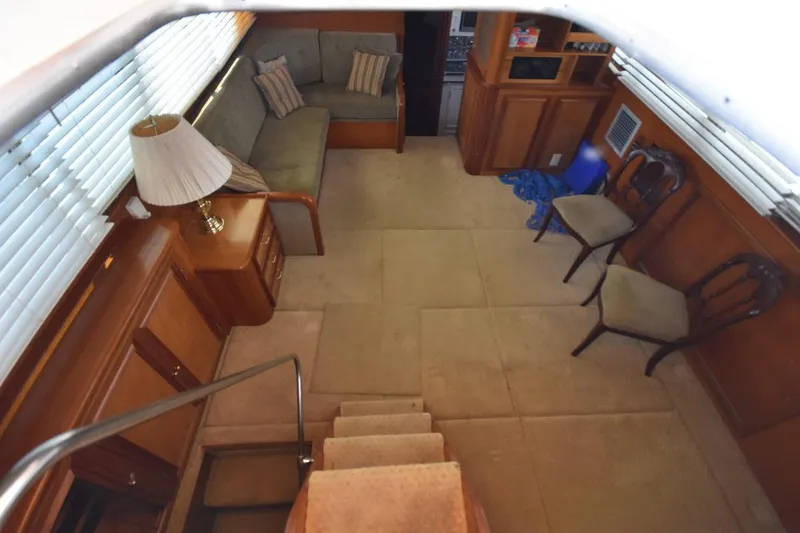 Slide: The Image of Interior of 1967 Hatteras 41 Twin Cabin with cozy seating and wooden furnishings. - 20