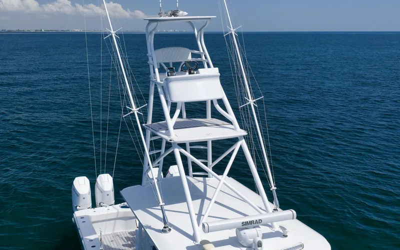 Slide: The Image of Freeman 47 boat, 2022 model, with tower and ocean backdrop. - 10