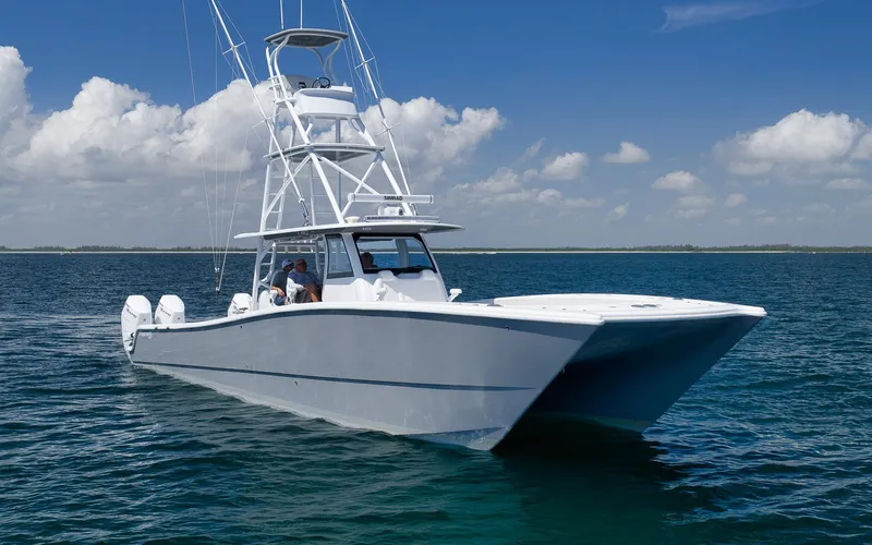 Slide: The Image of 2022 Freeman 47 boat on open water under blue sky. - 11