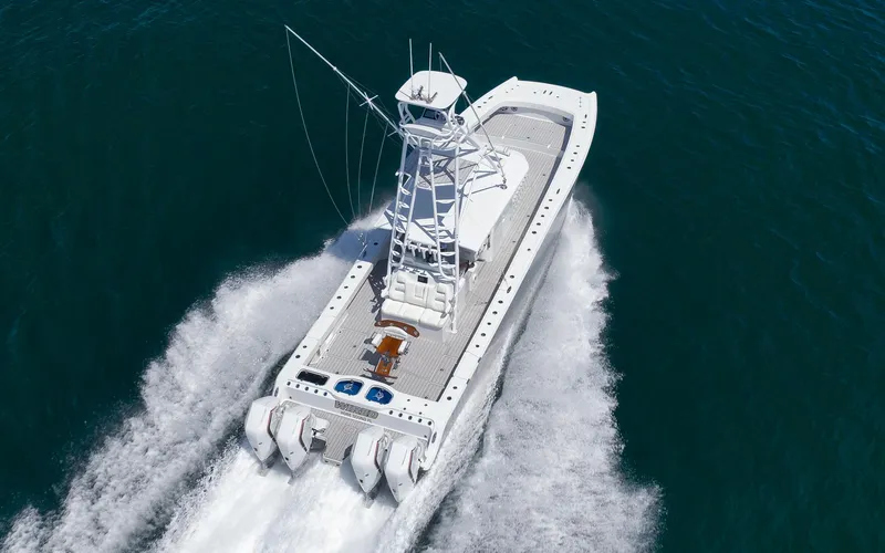 Slide: The Image of Aerial view of 2022 Freeman 47 boat cruising on open water. - 14