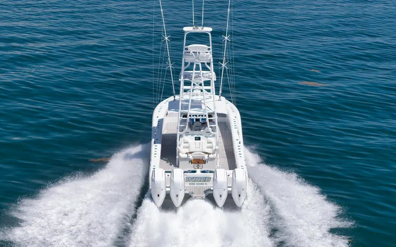 Slide: The Image of Freeman 47 boat cruising on open water, 2022 model, rear view. - 15