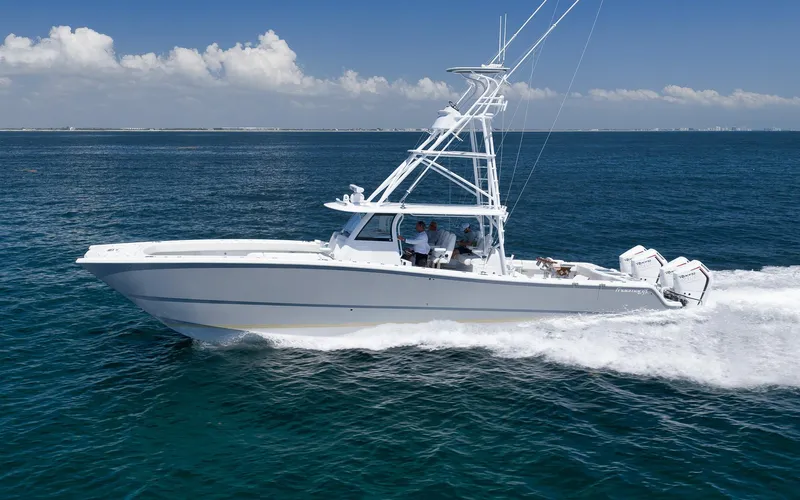 Slide: The Image of 2022 Freeman 47 boat cruising on open ocean under clear blue sky. - 17