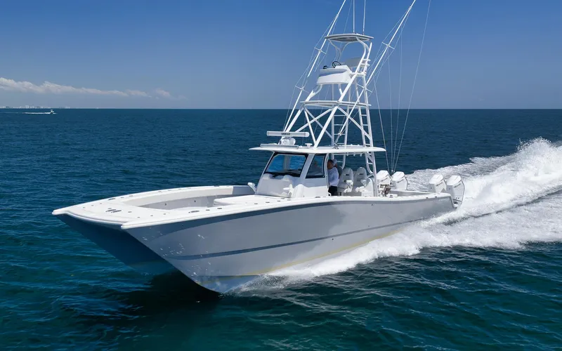 Slide: The Image of 2022 Freeman 47 boat cruising on open ocean under clear blue sky. - 18