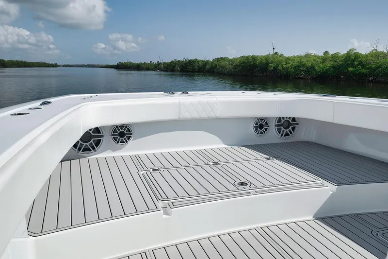 Slide: The Image of Freeman 47 boat deck, 2022 model, with sleek design and scenic water view. - 20