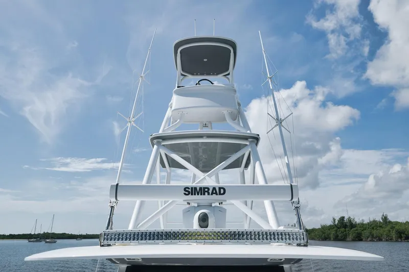 Slide: The Image of Freeman 47 boat, 2022 model, featuring Simrad equipment against a clear blue sky. - 24