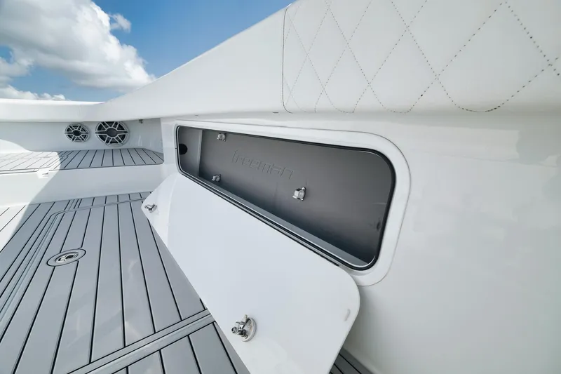 Slide: The Image of Freeman 47 boat deck with storage compartment, 2022 model, featuring sleek design and modern finishes. - 26