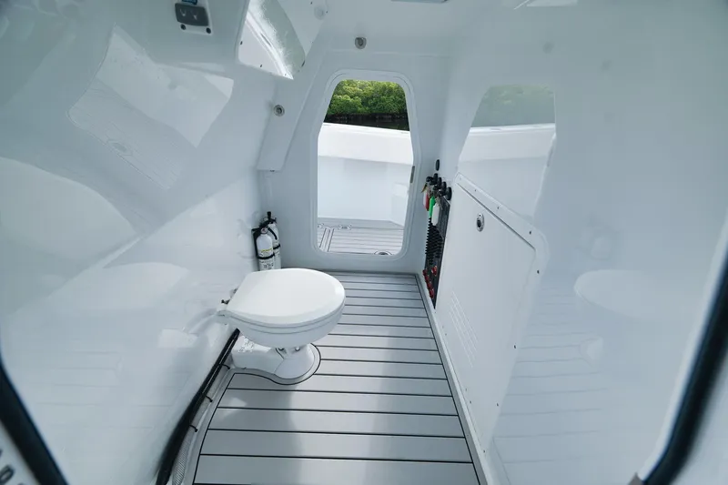 Slide: The Image of Interior of a 2022 Freeman 47 boat featuring a sleek, modern bathroom design. - 28