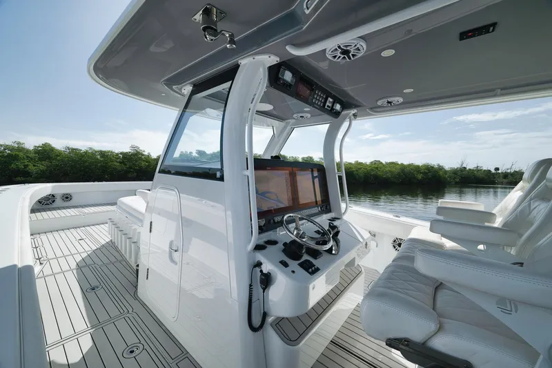 Slide: The Image of 2022 Freeman 47 boat cockpit with modern navigation system and luxurious seating. - 30