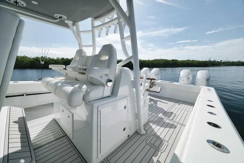 Slide: The Image of Luxurious 2022 Freeman 47 boat interior with sleek seating and multiple outboard engines. - 35