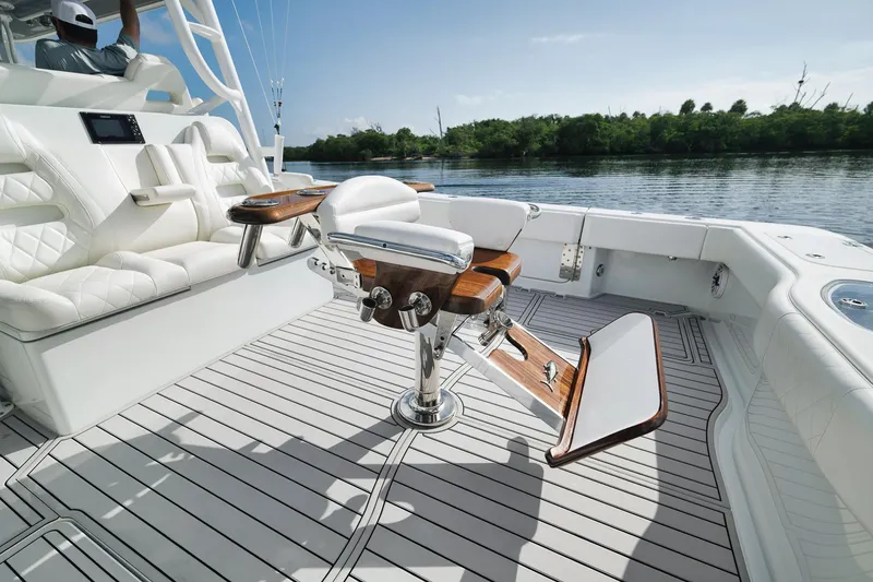 Slide: The Image of Luxury seating on a 2022 Freeman 47 boat with elegant wood and white upholstery. - 38