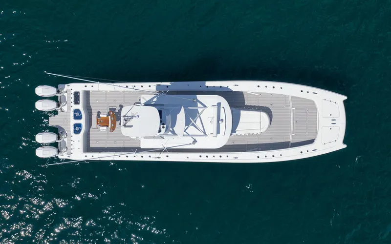 Slide: The Image of Aerial view of 2022 Freeman 47 boat on clear blue water. - 48