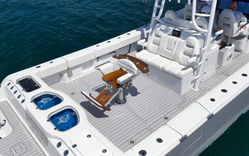 Slide: The Image of Freeman 47 boat deck with seating and fishing equipment, 2022 model. - 49