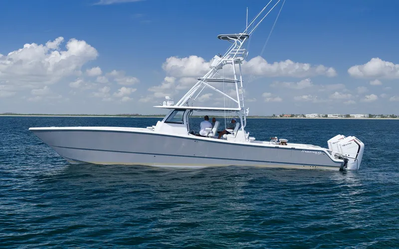 Slide: The Image of 2022 Freeman 47 boat on open water under clear blue sky. - 5