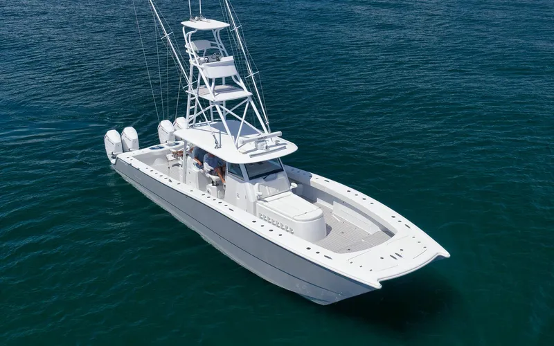 Slide: The Image of Freeman 47 boat, 2022 model, cruising on clear blue water. - 9