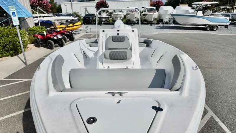 Slide: The Image of 2026 ALK2 Powerboats 18 CRS, white boat with seating, parked in a marina. - 7