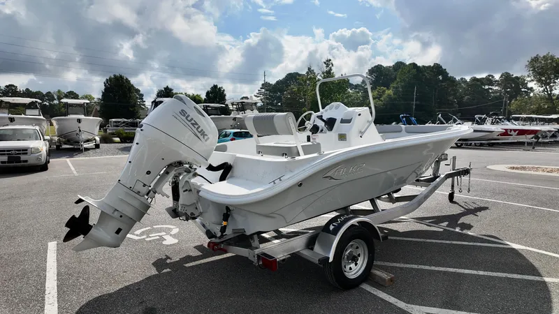 Slide: The Image of 2026 ALK2 Powerboats 18 CRS on trailer, featuring Suzuki outboard motor, parked outdoors. - 9