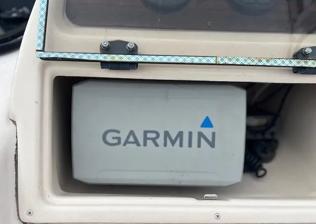 Slide: The Image of Garmin device installed on a 2000 Grady-White Adventure 208 boat dashboard. - 5