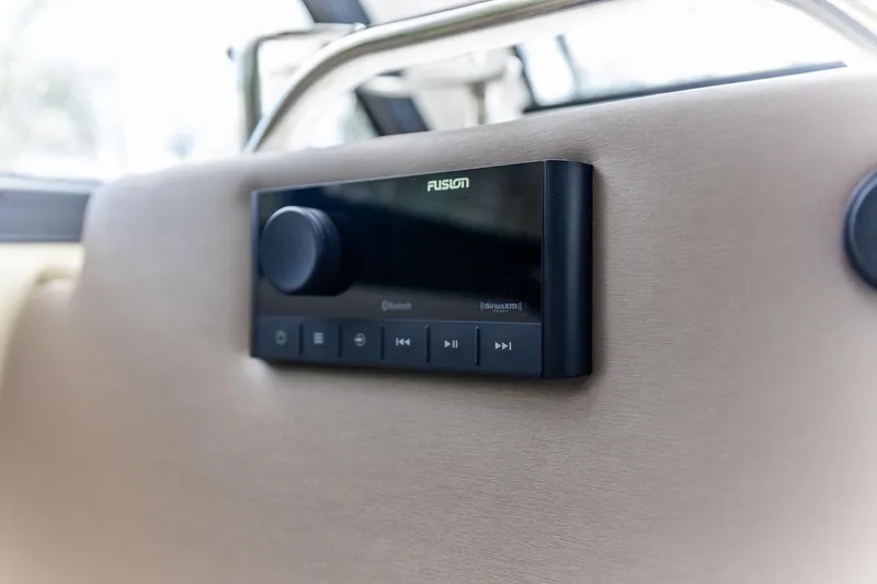 Slide: The Image of Fusion audio system in 2023 Cutwater C-248 Coupe boat interior. - 11