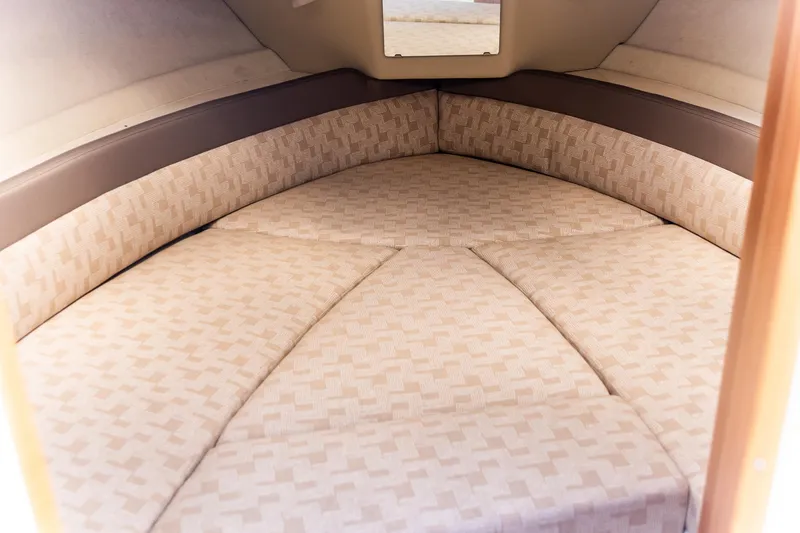 Slide: The Image of 2023 Cutwater C-248 Coupe interior cabin with patterned cushions. - 18