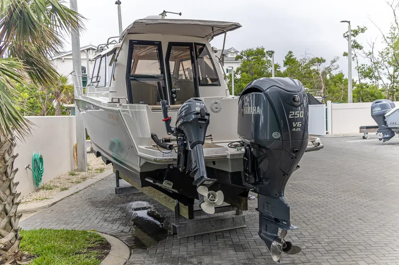 Slide: The Image of 2023 Cutwater C-248 Coupe boat with Yamaha outboard engines on display. - 2