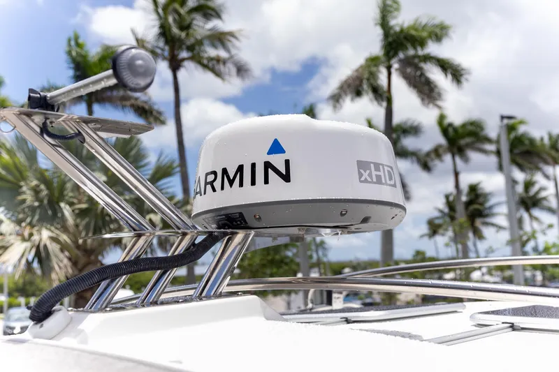 Slide: The Image of 2023 Cutwater C-248 Coupe with Garmin xHD radar, palm trees in background. - 21