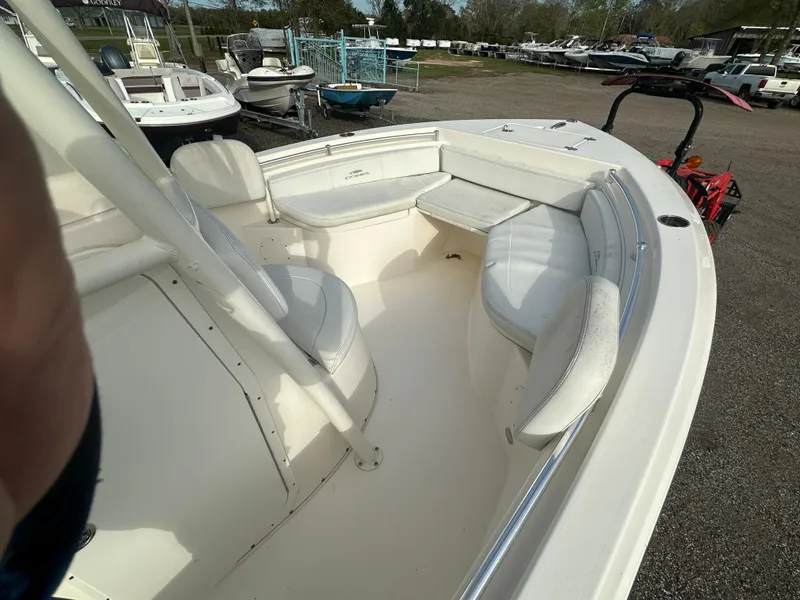 Slide: The Image of 2022 Cobia 220 Center Console boat with spacious seating area. - 12