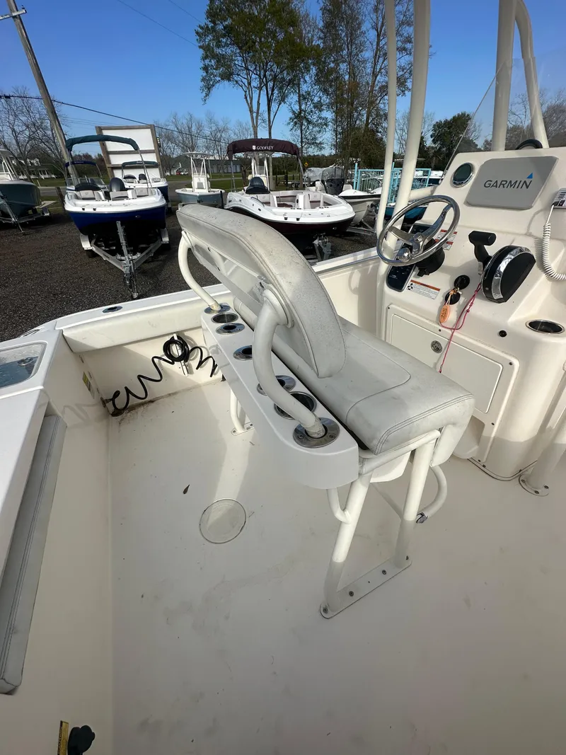 Slide: The Image of 2022 Cobia 220 Center Console boat interior with helm and seating. - 23