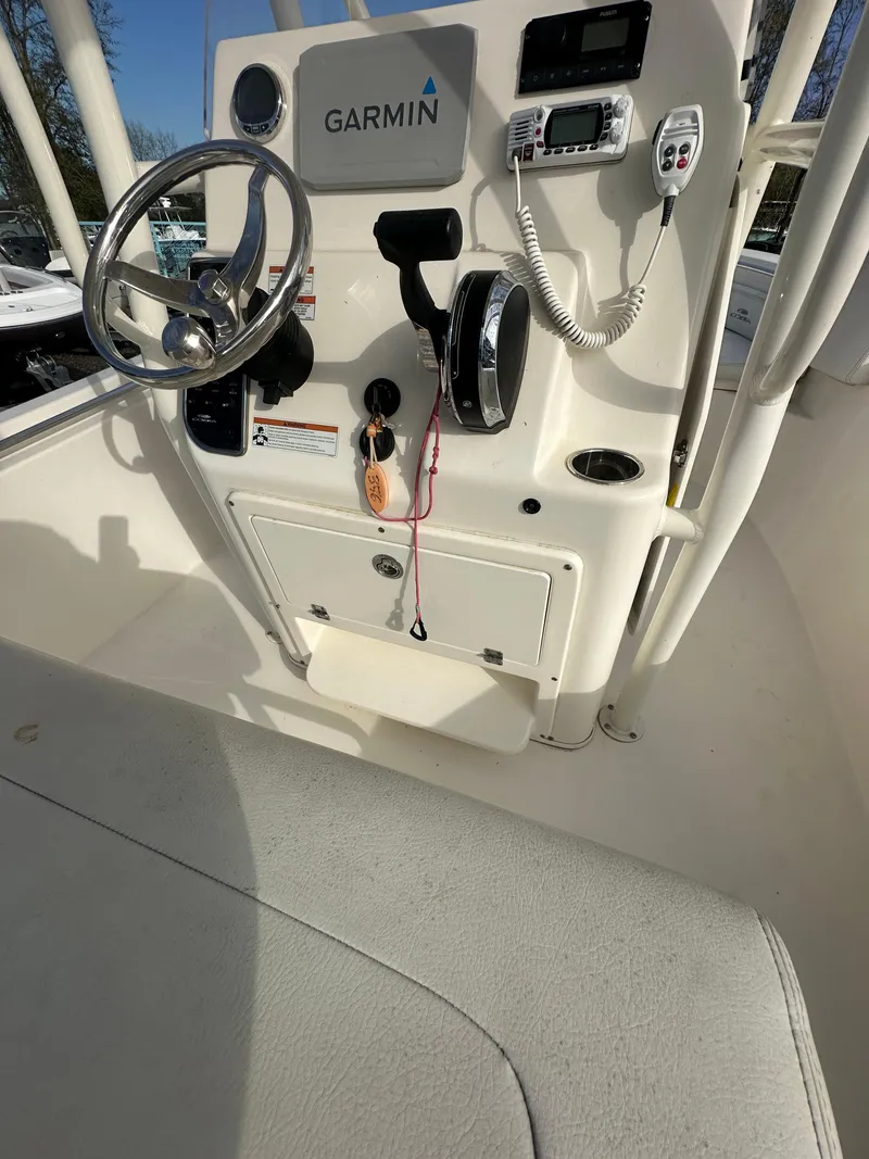 Slide: The Image of 2022 Cobia 220 Center Console boat dashboard with Garmin navigation system. - 26