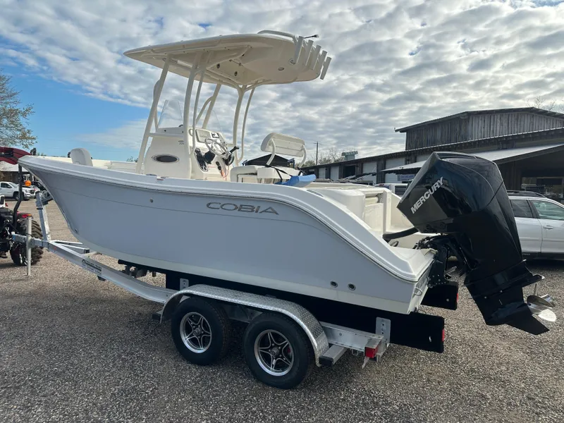 Slide: The Image of 2022 Cobia 220 Center Console boat on trailer with Mercury outboard motor. - 7