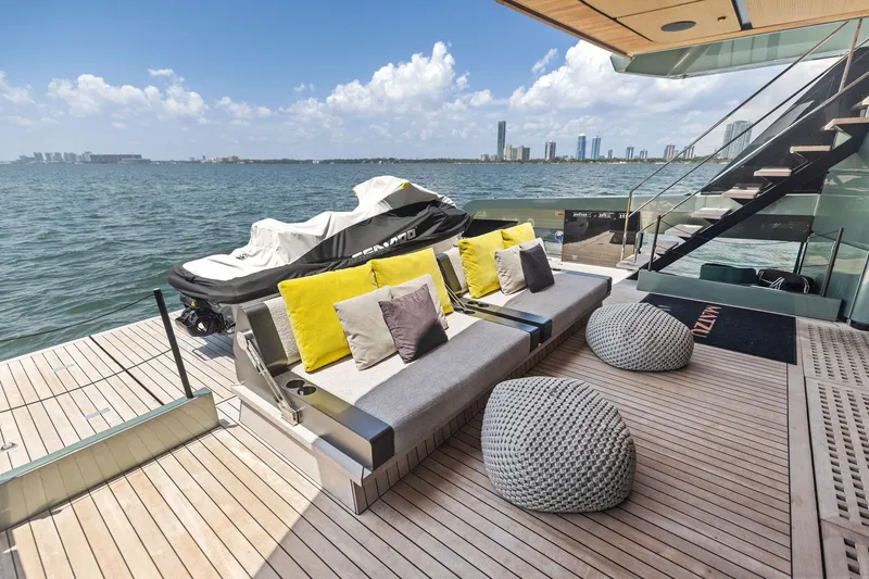 Slide: The Image of Luxurious 2023 Wally WHY 150 yacht deck with seating, cushions, and sea view. - 108