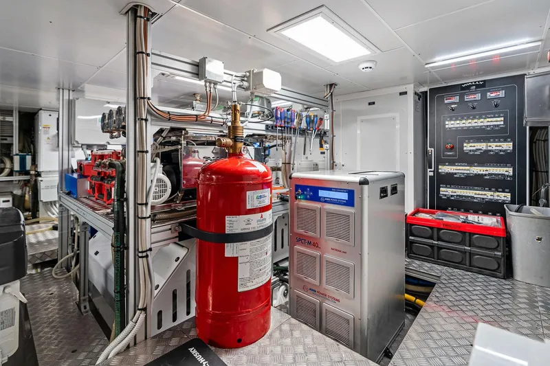 Slide: The Image of Engine room of 2023 Wally WHY 150 yacht, featuring advanced equipment and control panels. - 111