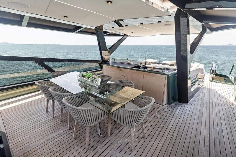 Slide: The Image of Luxurious 2023 Wally WHY 150 yacht deck with elegant dining area and ocean view. - 13