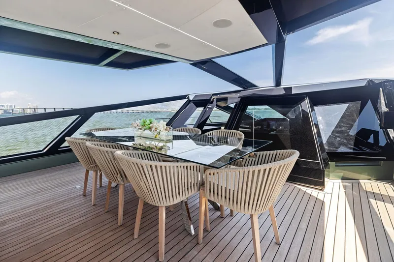 Slide: The Image of Luxurious 2023 Wally WHY 150 yacht deck with elegant dining area and panoramic views. - 16