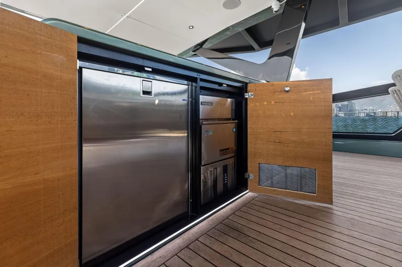 Slide: The Image of Open storage compartment on 2023 Wally WHY 150 yacht, featuring stainless steel appliances. - 18