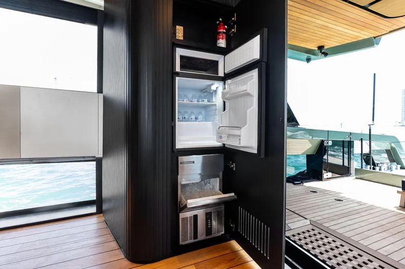 Slide: The Image of Open refrigerator on Wally WHY 150 yacht, showcasing modern interior design, 2023 model. - 28