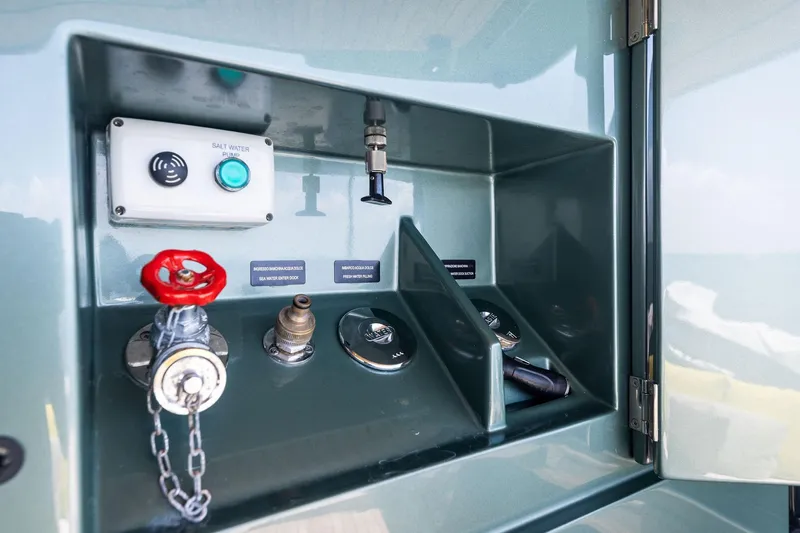 Slide: The Image of Control panel on 2023 Wally WHY 150 yacht, featuring valves and a saltwater pump. - 30