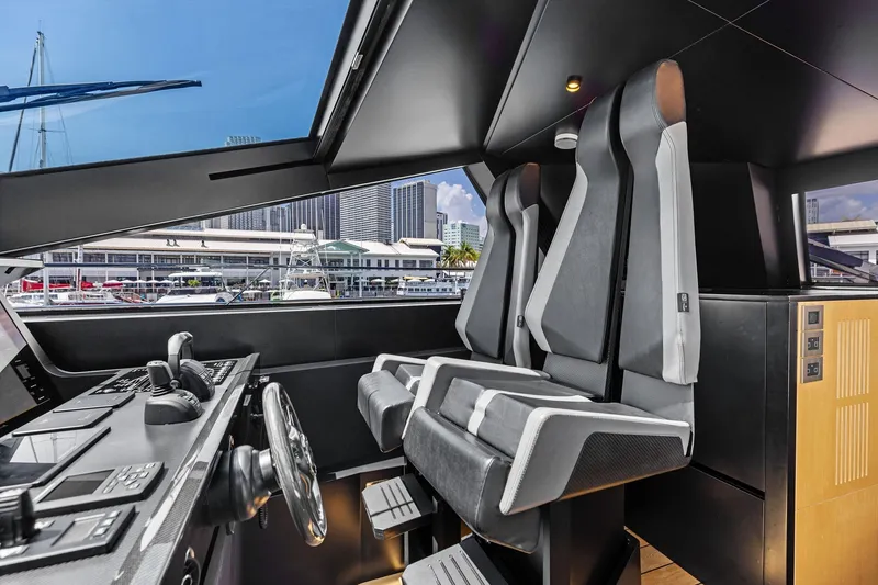 Slide: The Image of Interior of 2023 Wally WHY 150 yacht cockpit with modern seating and control panel. - 35