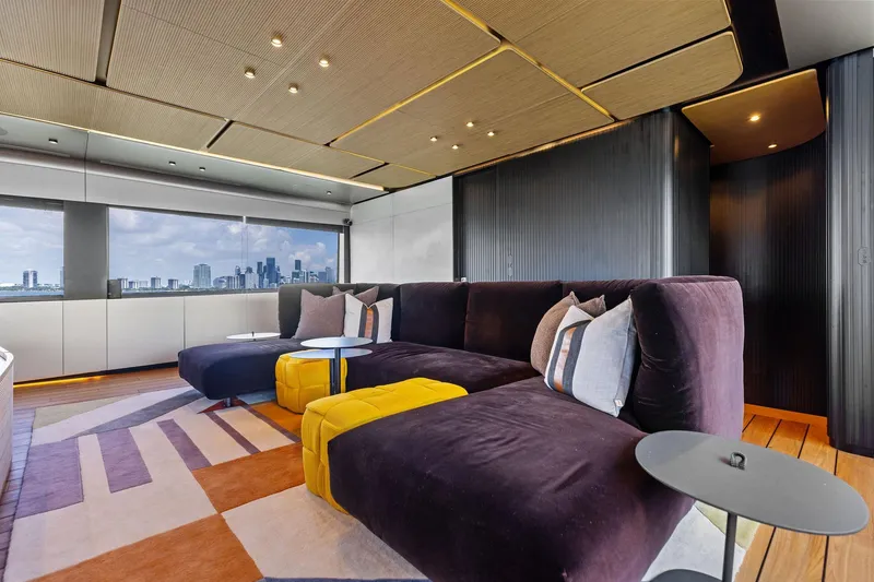 Slide: The Image of Luxurious interior of 2023 Wally WHY 150 yacht with modern seating and city skyline view. - 45